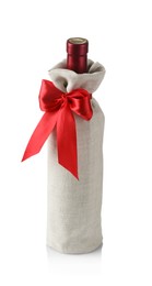 Photo of Wine bottle in burlap package with red ribbon isolated on white