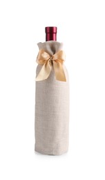 Photo of Wine bottle in burlap package with ribbon isolated on white