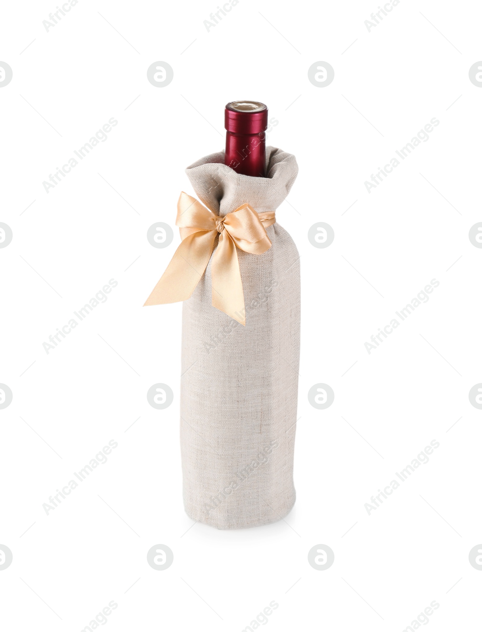 Photo of Wine bottle in burlap package with ribbon isolated on white