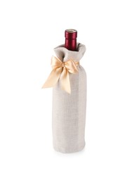 Wine bottle in burlap package with ribbon isolated on white