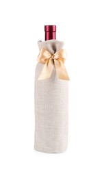 Photo of Wine bottle in burlap package with ribbon isolated on white