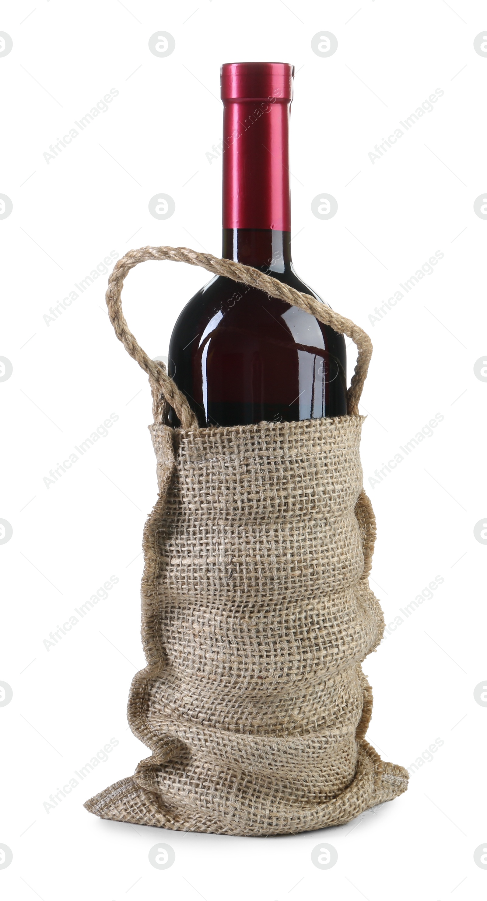 Photo of Wine bottle in burlap bag isolated on white