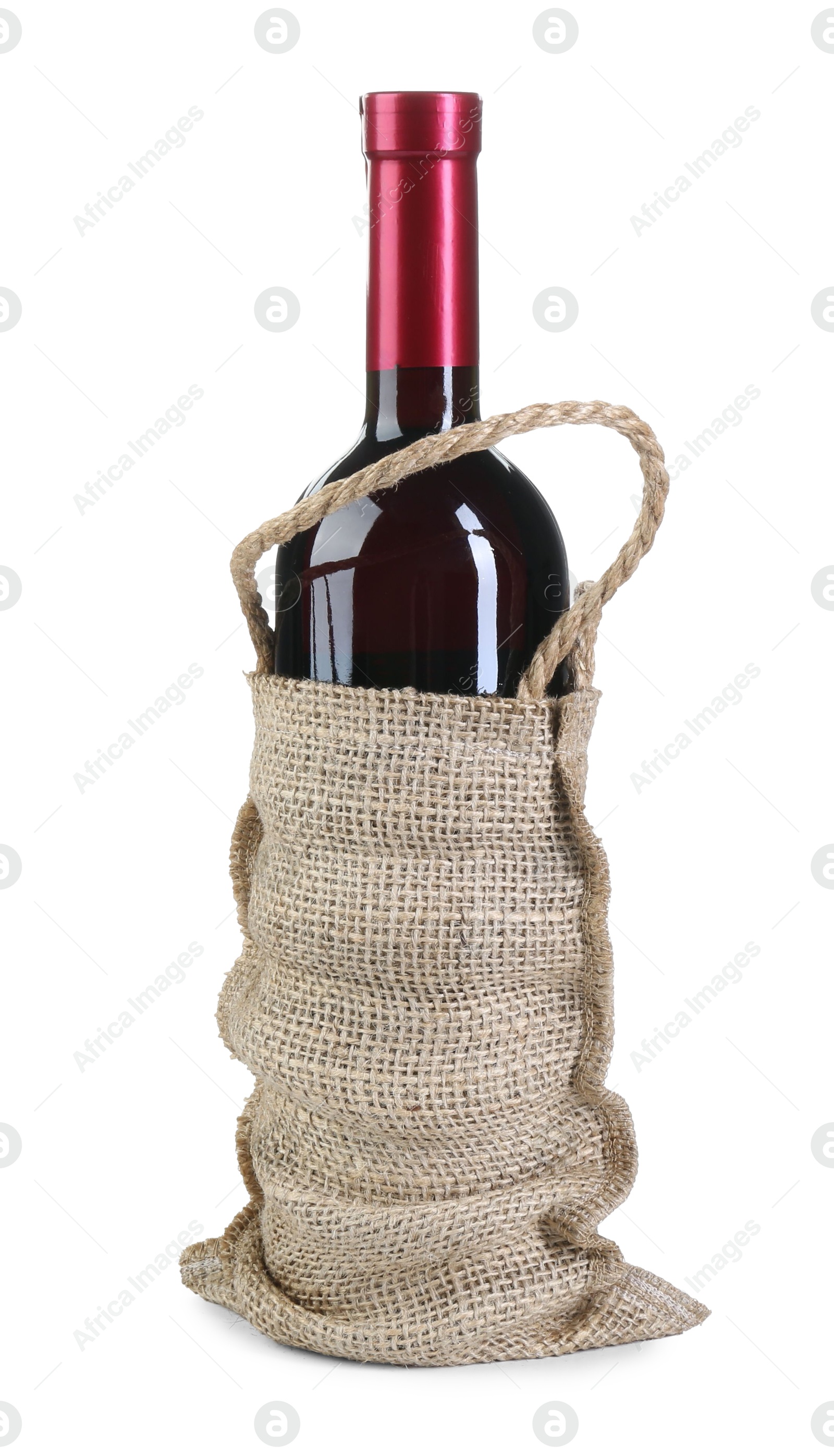 Photo of Wine bottle in burlap bag isolated on white