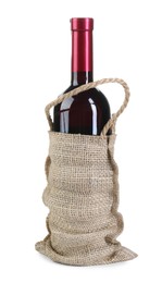 Photo of Wine bottle in burlap bag isolated on white