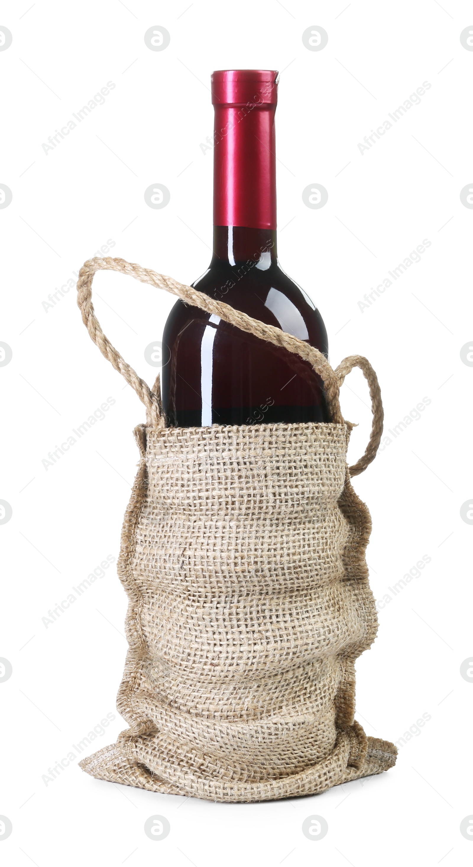 Photo of Wine bottle in burlap bag isolated on white