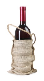 Wine bottle in burlap bag isolated on white