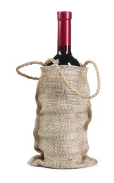 Wine bottle in burlap bag isolated on white