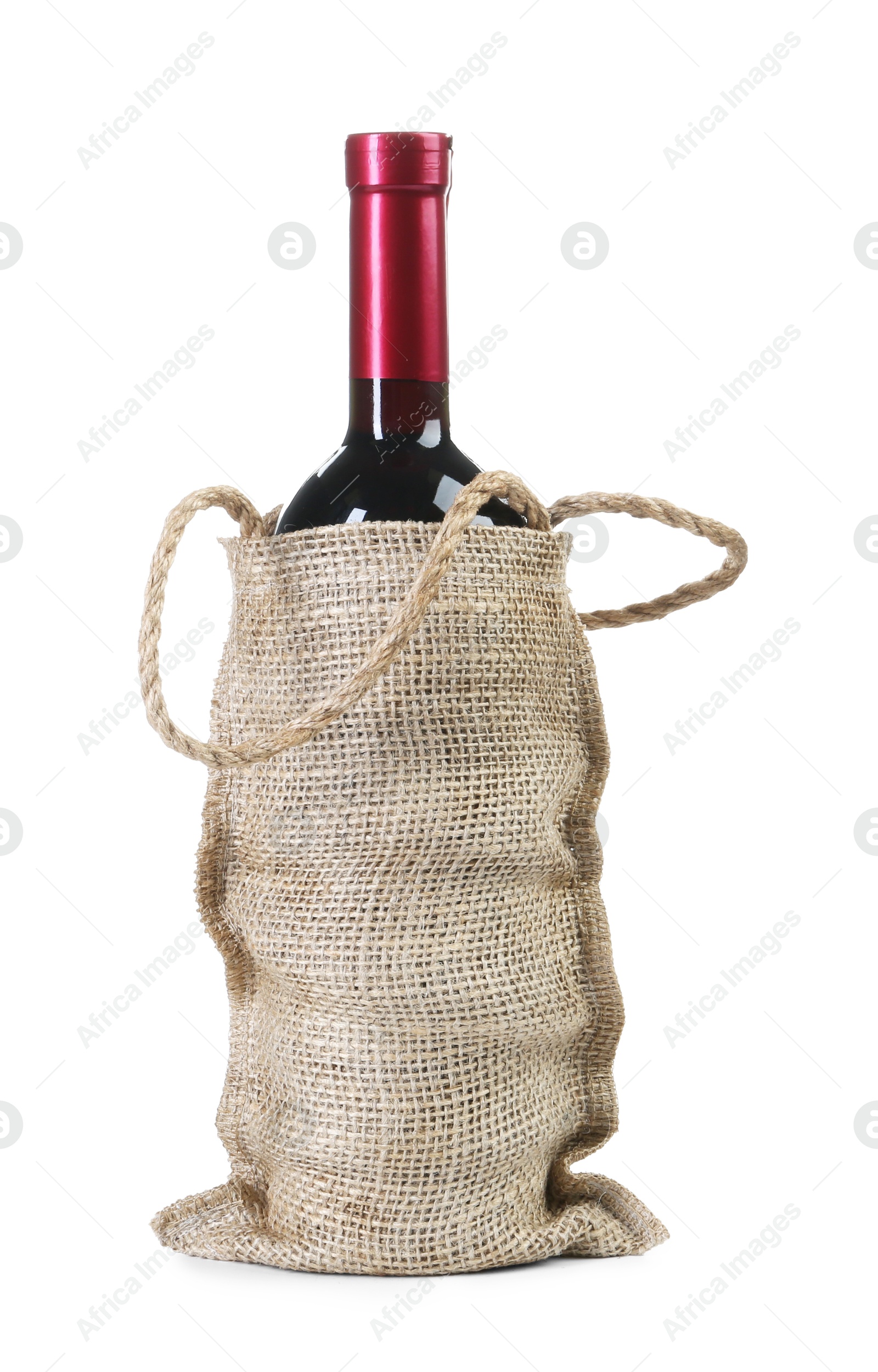 Photo of Wine bottle in burlap bag isolated on white