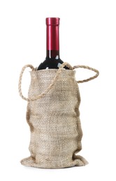 Wine bottle in burlap bag isolated on white