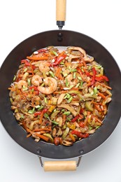 Photo of Stir-fry sea food in wok on white background, top view