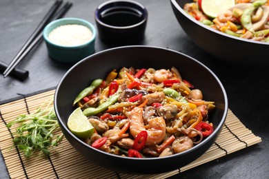 Stir-fry sea food served on grey table