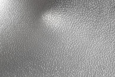 Photo of Shiny silver surface as background, top view