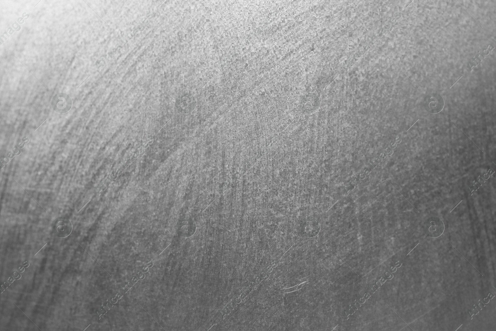 Photo of Shiny silver surface as background, closeup view