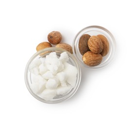 Photo of Shea butter in bowl and nuts isolated on white, top view