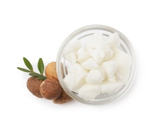 Photo of Shea butter in bowl and nuts isolated on white, top view