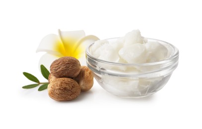 Shea butter in bowl, flower and nuts isolated on white