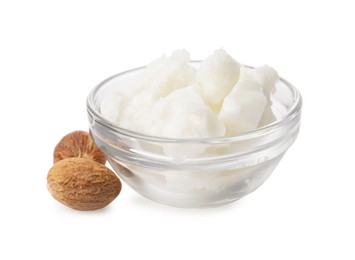 Shea butter in bowl and nuts isolated on white