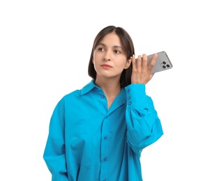 Photo of Beautiful woman with smartphone listening to voice message on white background