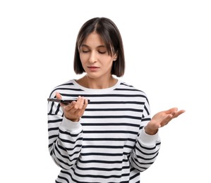 Photo of Beautiful woman recording voice message via smartphone on white background