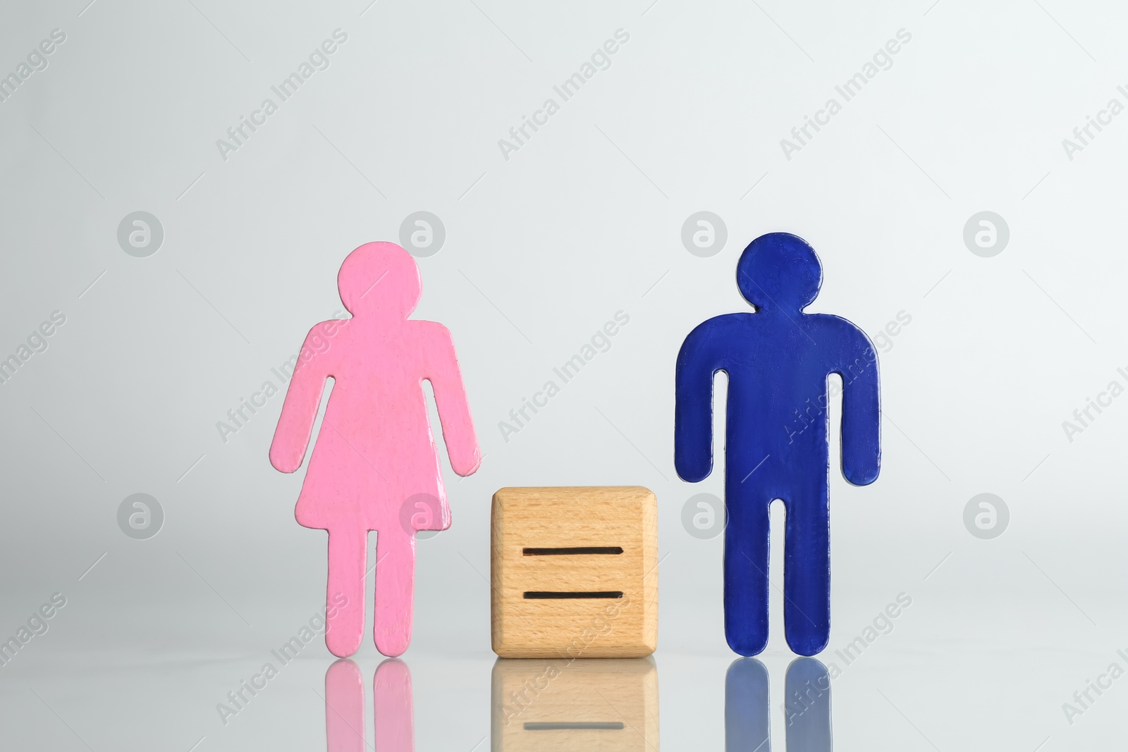 Photo of Gender equality concept. Male and female figures on light background