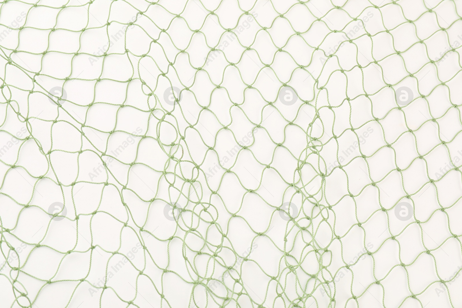 Photo of One green fishing net isolated on white, top view