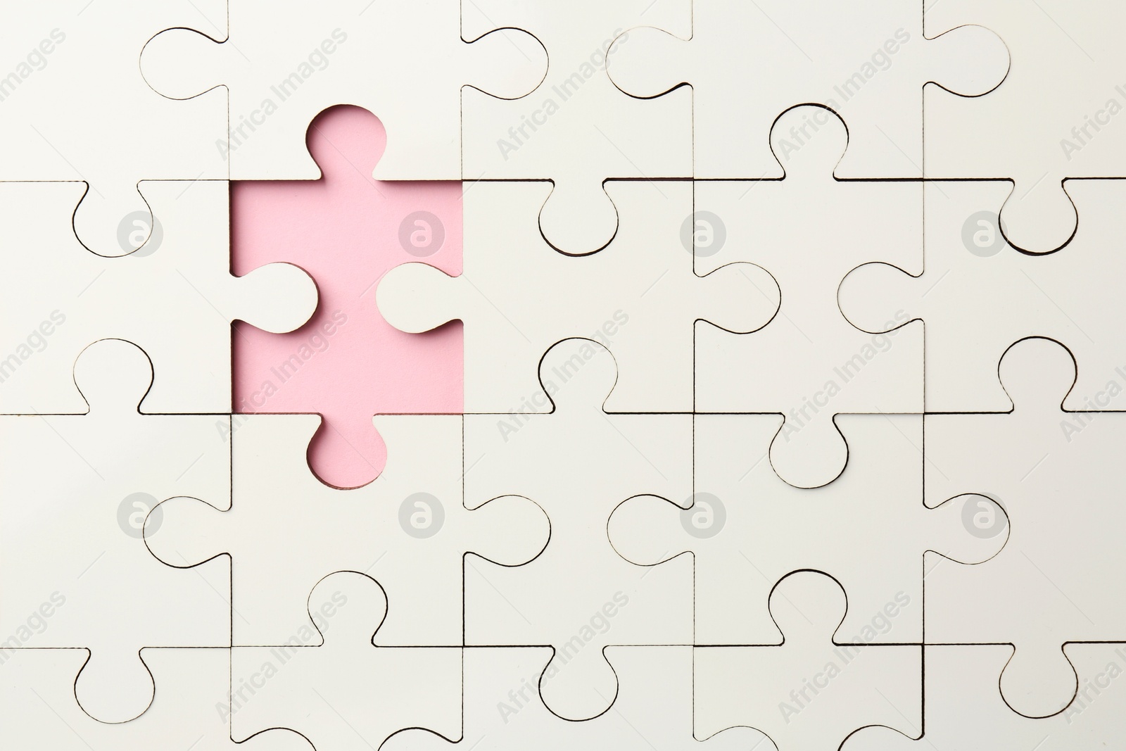 Photo of White puzzle with missing piece on pink background, top view