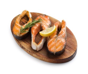 Photo of Tasty grilled salmon steaks, lemon and rosemary isolated on white