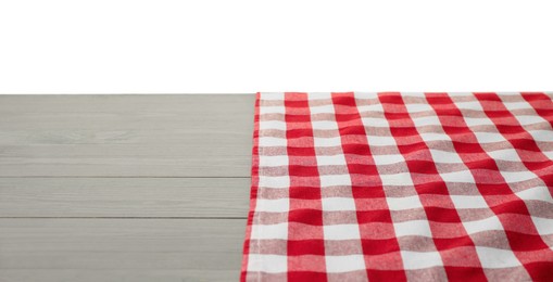 Photo of Tablecloth with checkered pattern on wooden table against white background