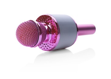 Photo of One pink karaoke microphone isolated on white