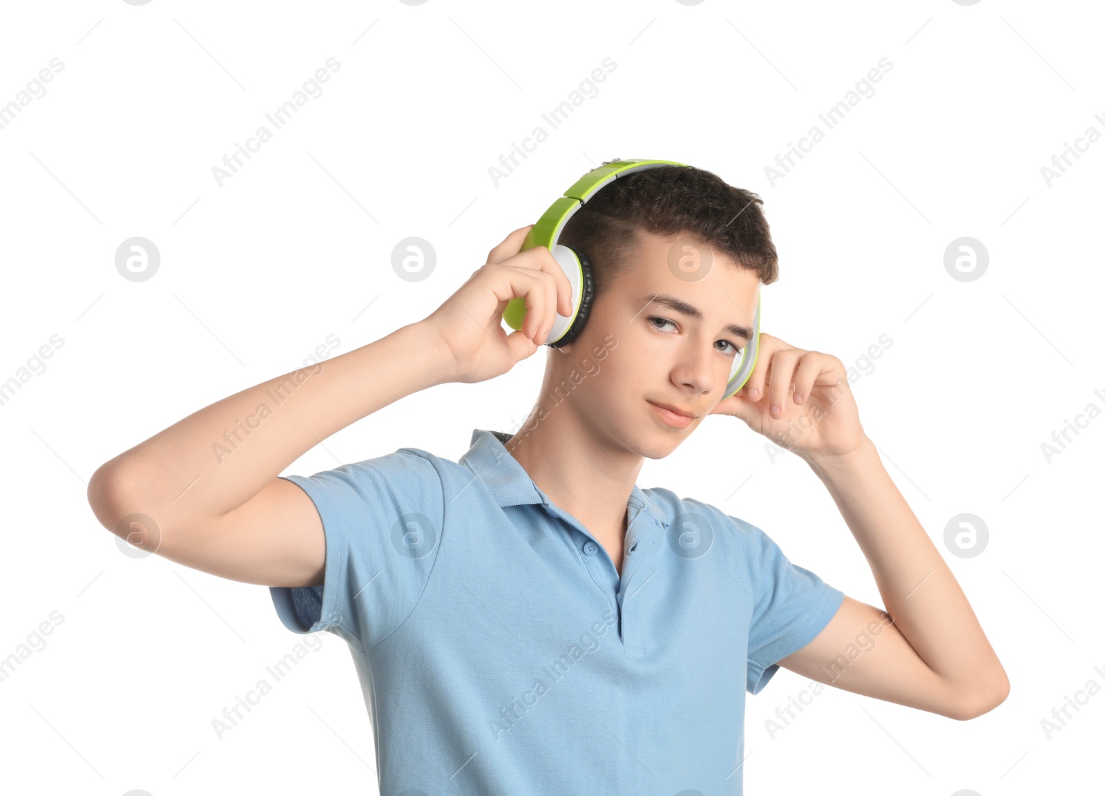 Photo of Portrait of teenage boy with headphones on white background