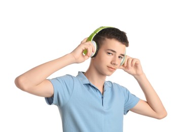 Portrait of teenage boy with headphones on white background