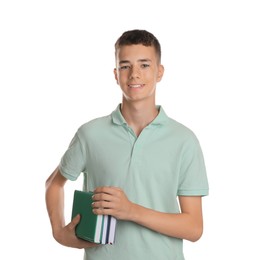 Portrait of teenage boy with books on white background