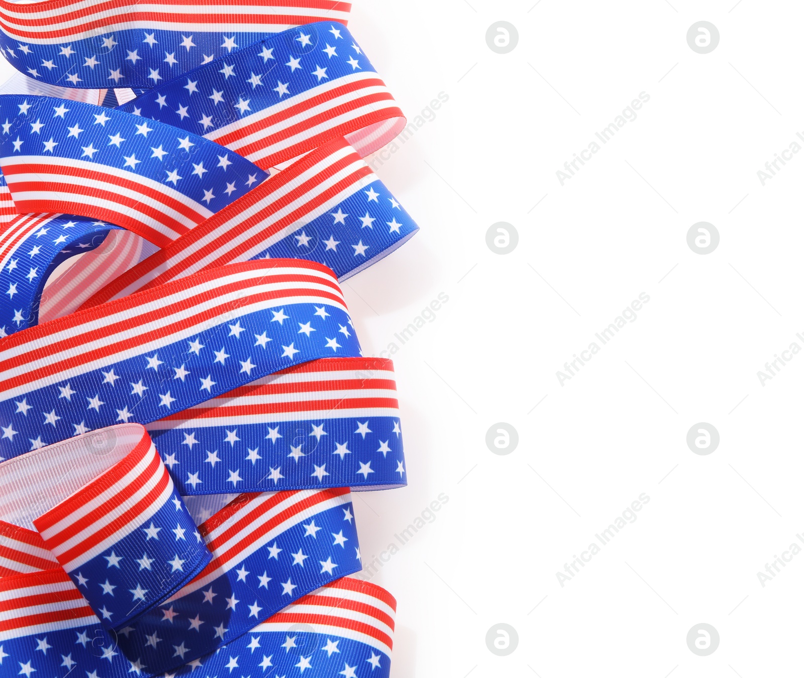 Photo of Ribbon in colors of American flag isolated on white, top view