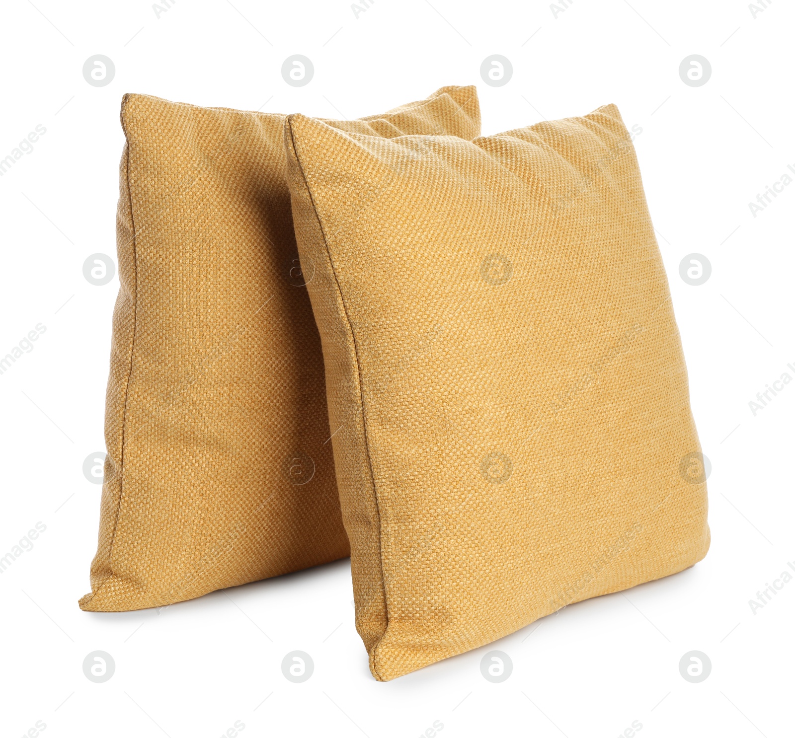 Photo of Two soft color pillows isolated on white