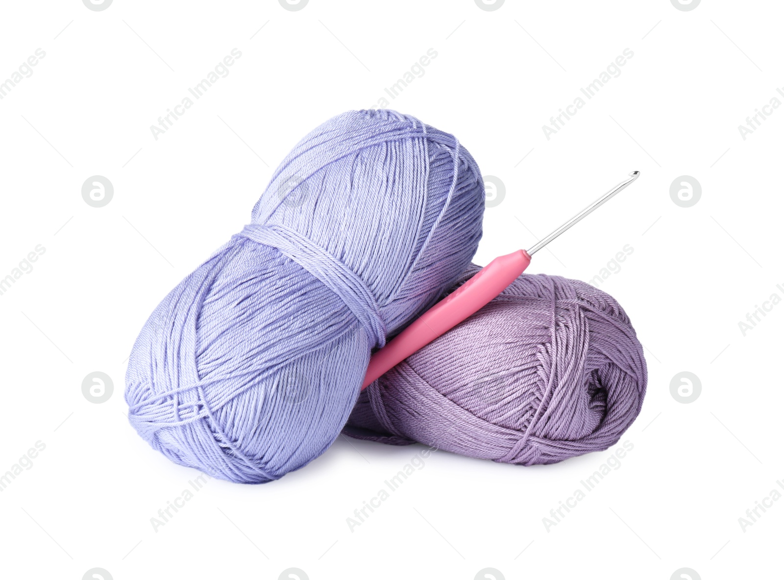 Photo of Skeins of colorful yarns and crochet hook isolated on white