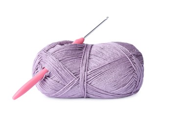 Photo of Skein of violet yarn and crochet hook isolated on white