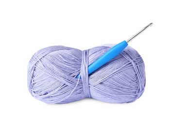 Photo of Skein of violet yarn and crochet hook isolated on white