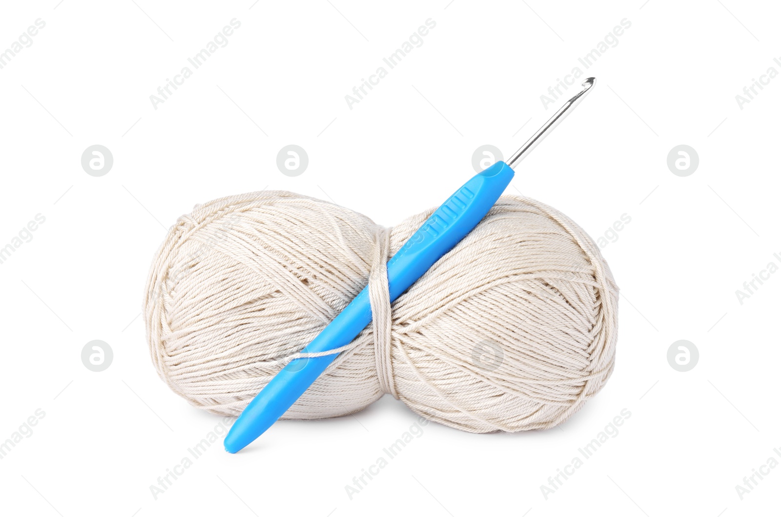 Photo of Skein of beige yarn and crochet hook isolated on white