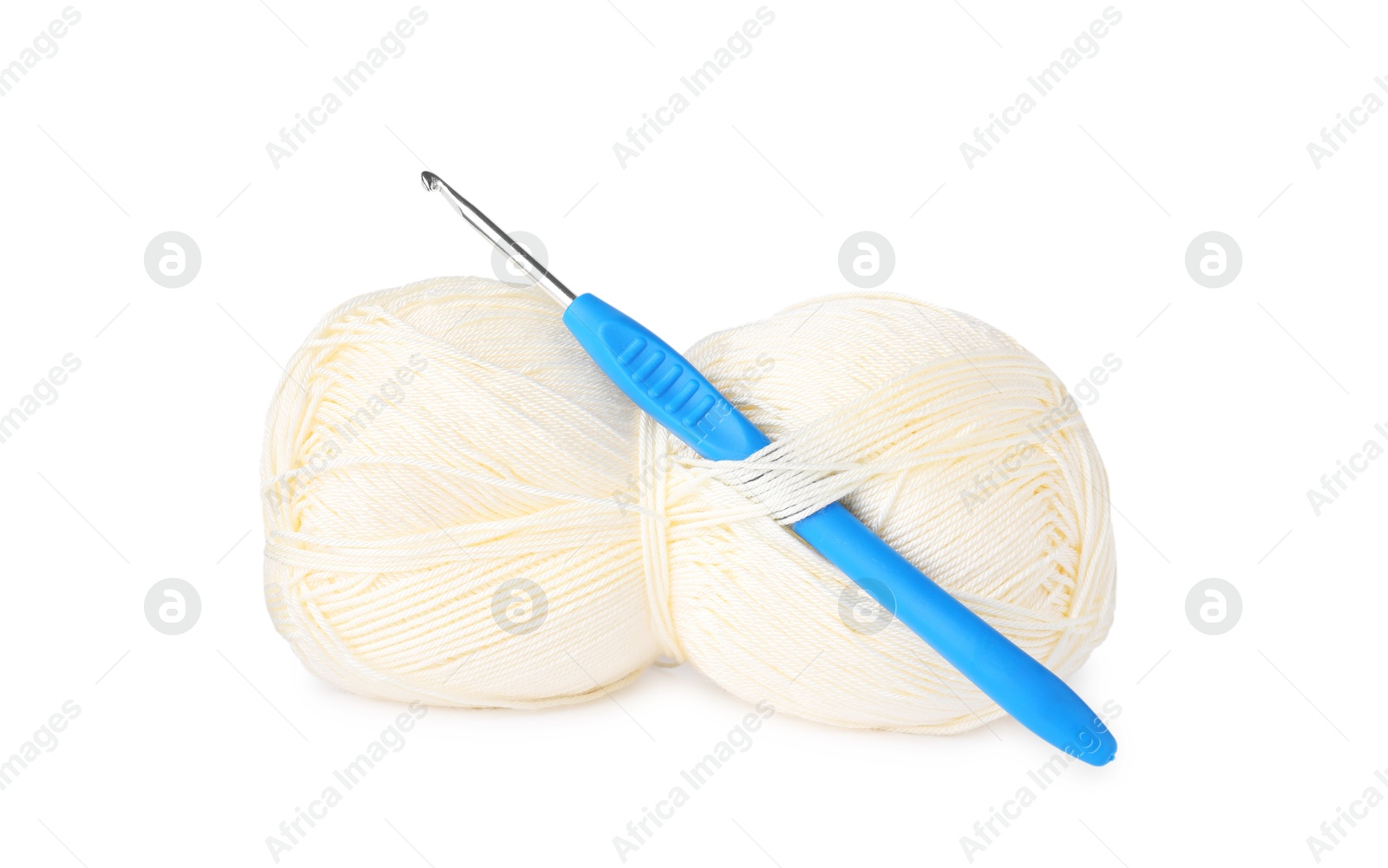 Photo of Skein of yellow yarn and crochet hook isolated on white