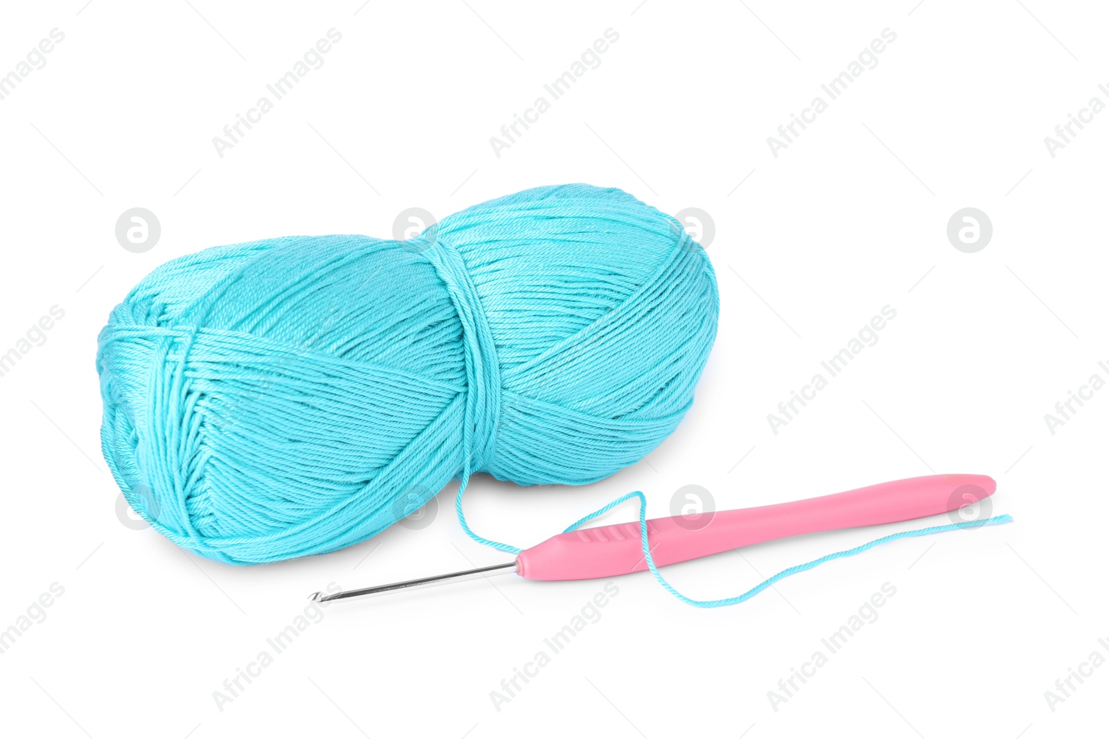 Photo of Skein of light blue yarn and crochet hook isolated on white