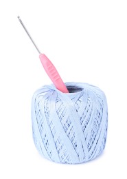 Photo of Thread of light blue yarn and crochet hook isolated on white