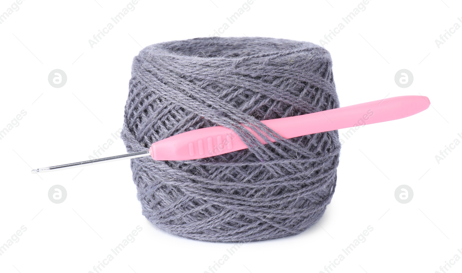 Photo of Thread of gray yarn and crochet hook isolated on white