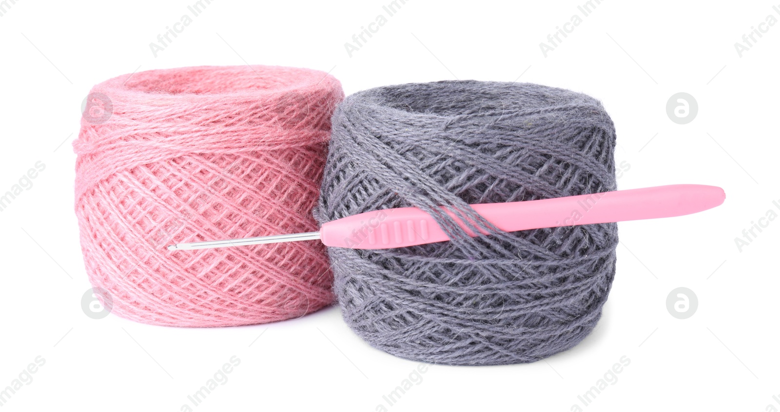 Photo of Threads of colorful yarns and crochet hook isolated on white