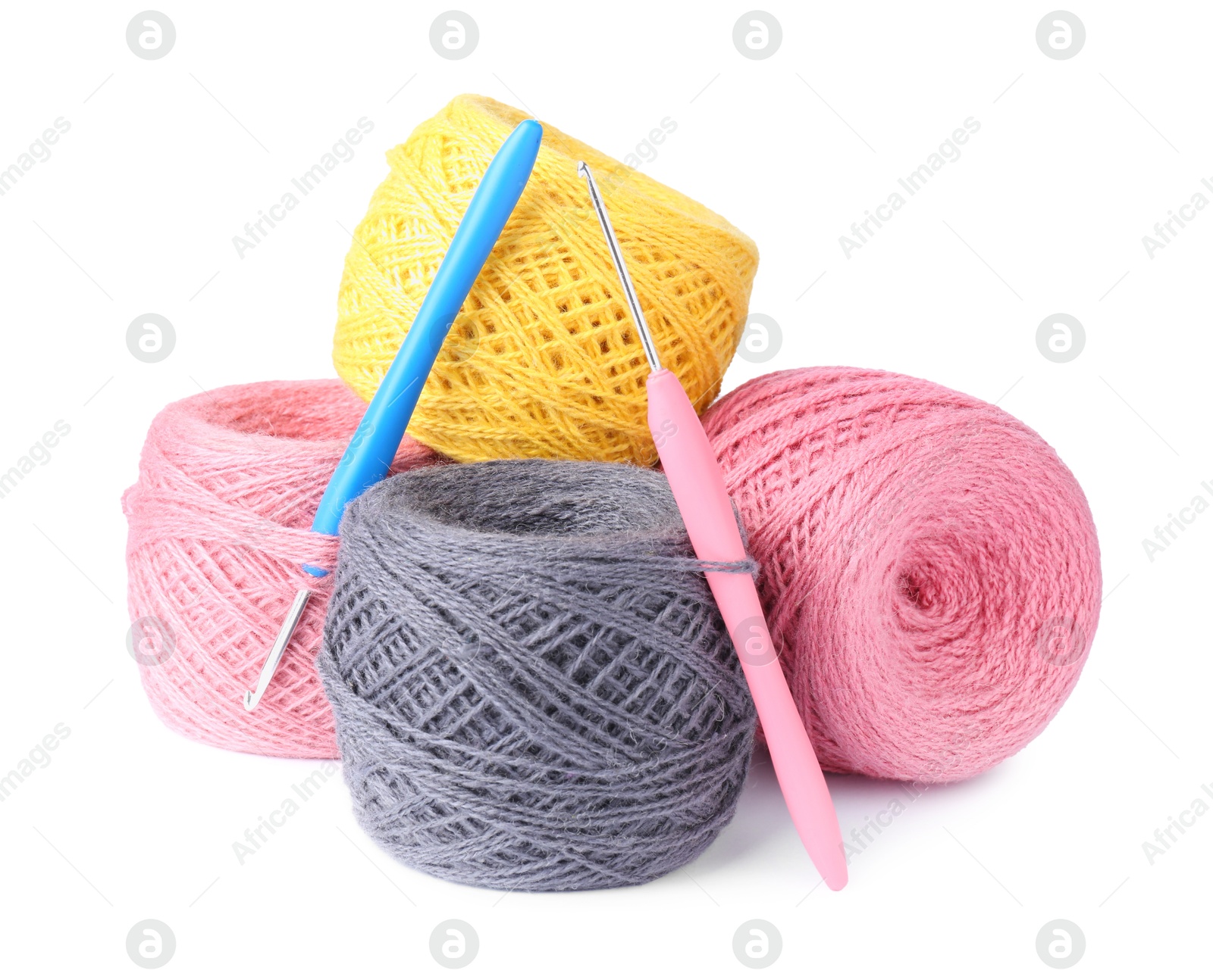 Photo of Threads of colorful yarns and crochet hooks isolated on white