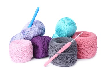 Photo of Many colorful yarns and crochet hooks isolated on white