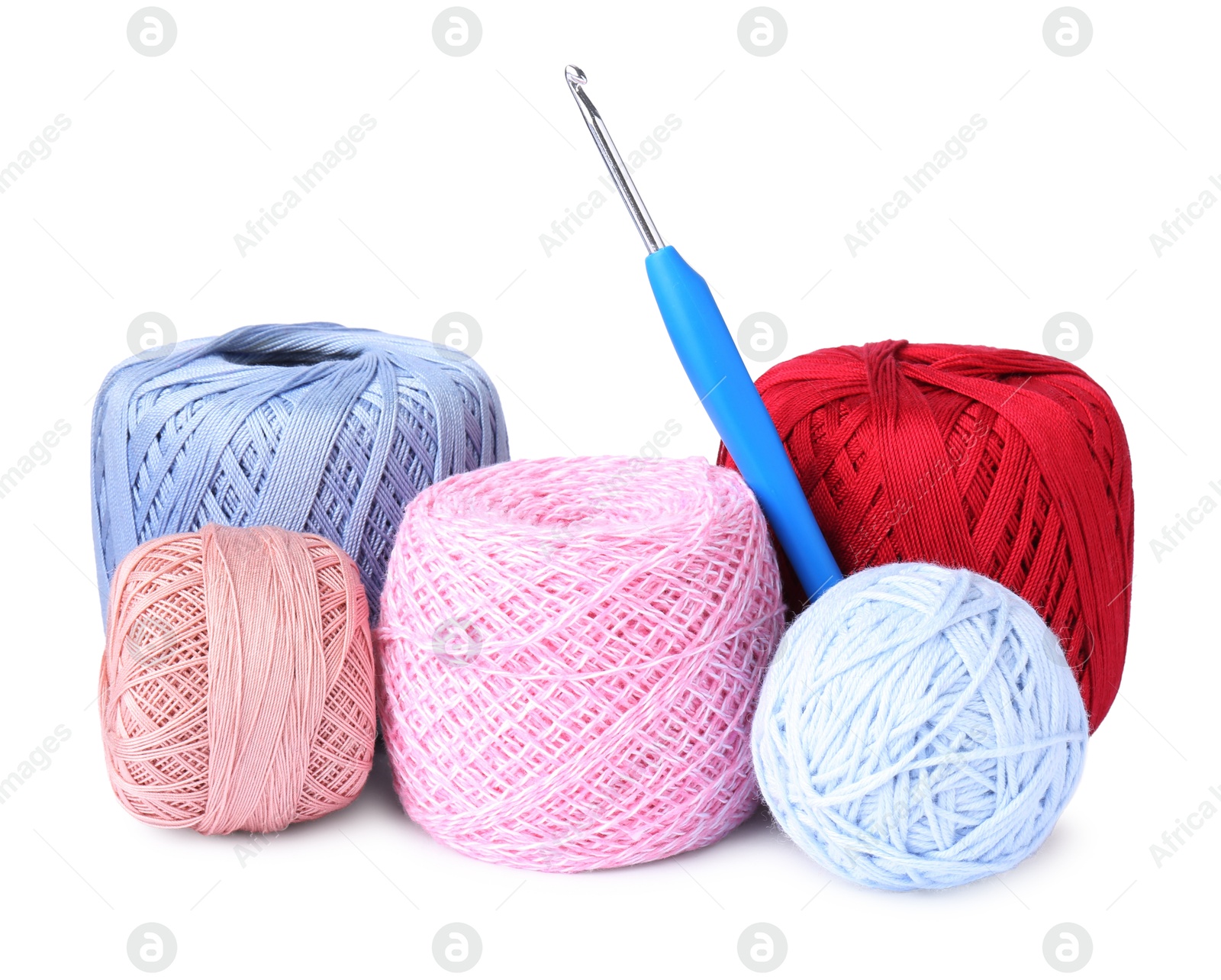 Photo of Many colorful yarns and crochet hook isolated on white