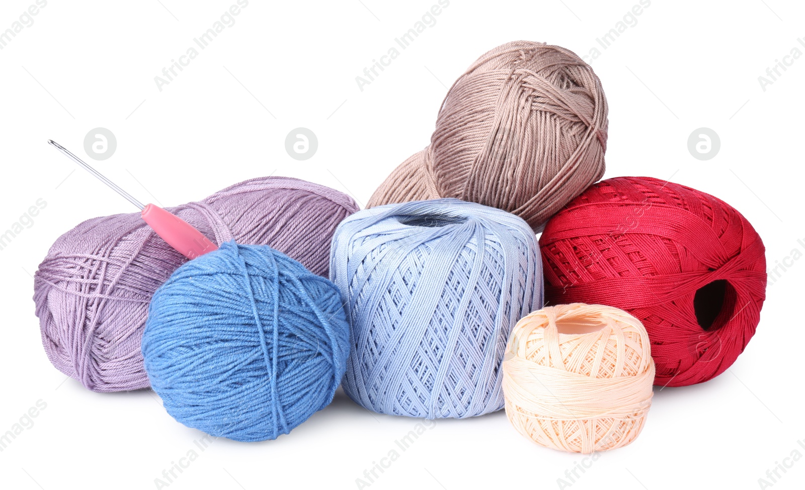 Photo of Many colorful yarns and crochet hook isolated on white