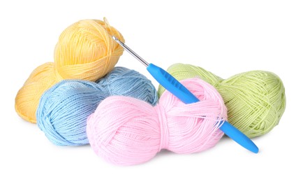 Photo of Many colorful yarns and crochet hook isolated on white