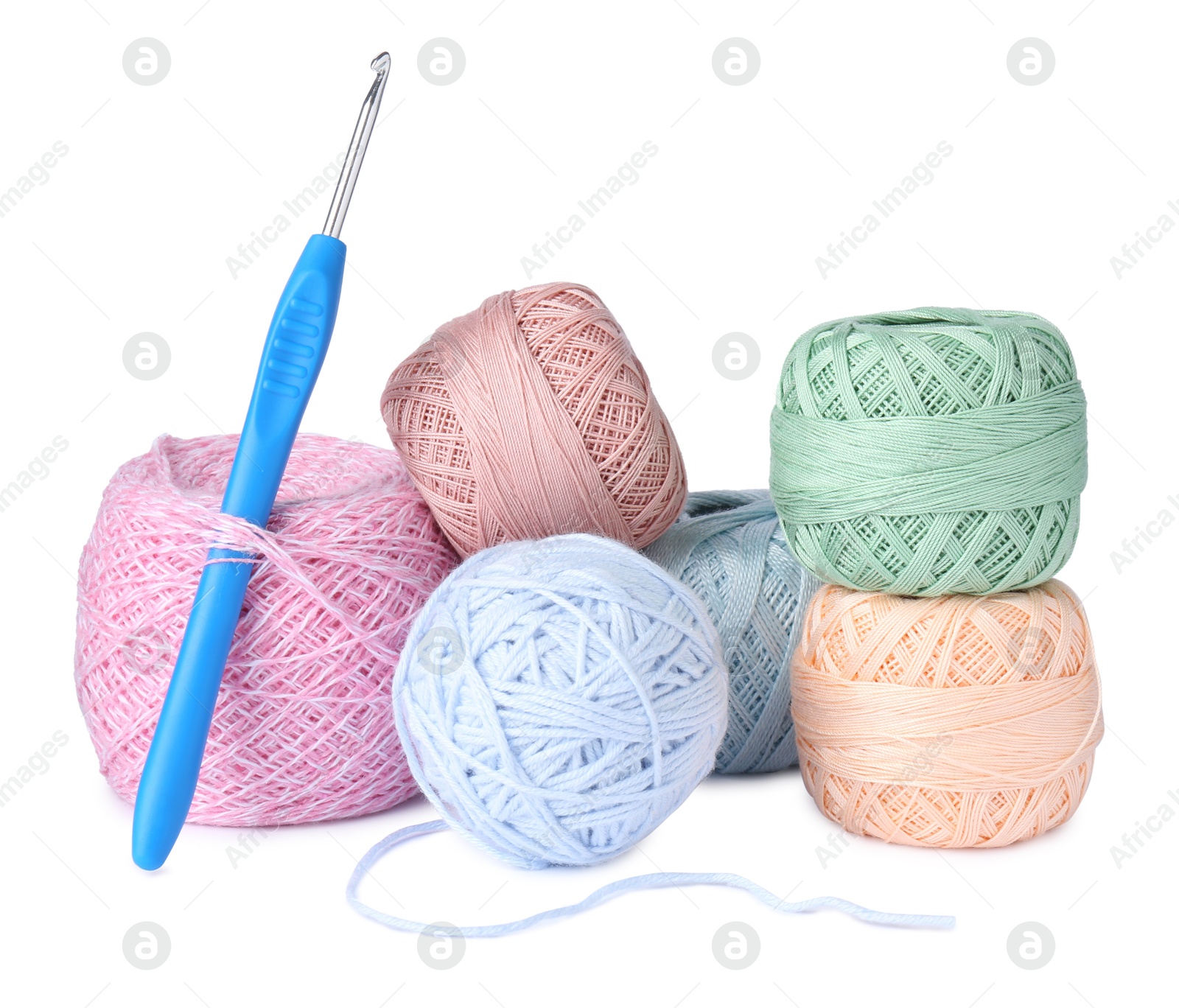 Photo of Many colorful yarns and crochet hook isolated on white