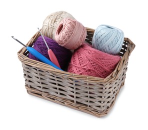 Photo of Many colorful yarns and crochet hooks in wicker basket isolated on white